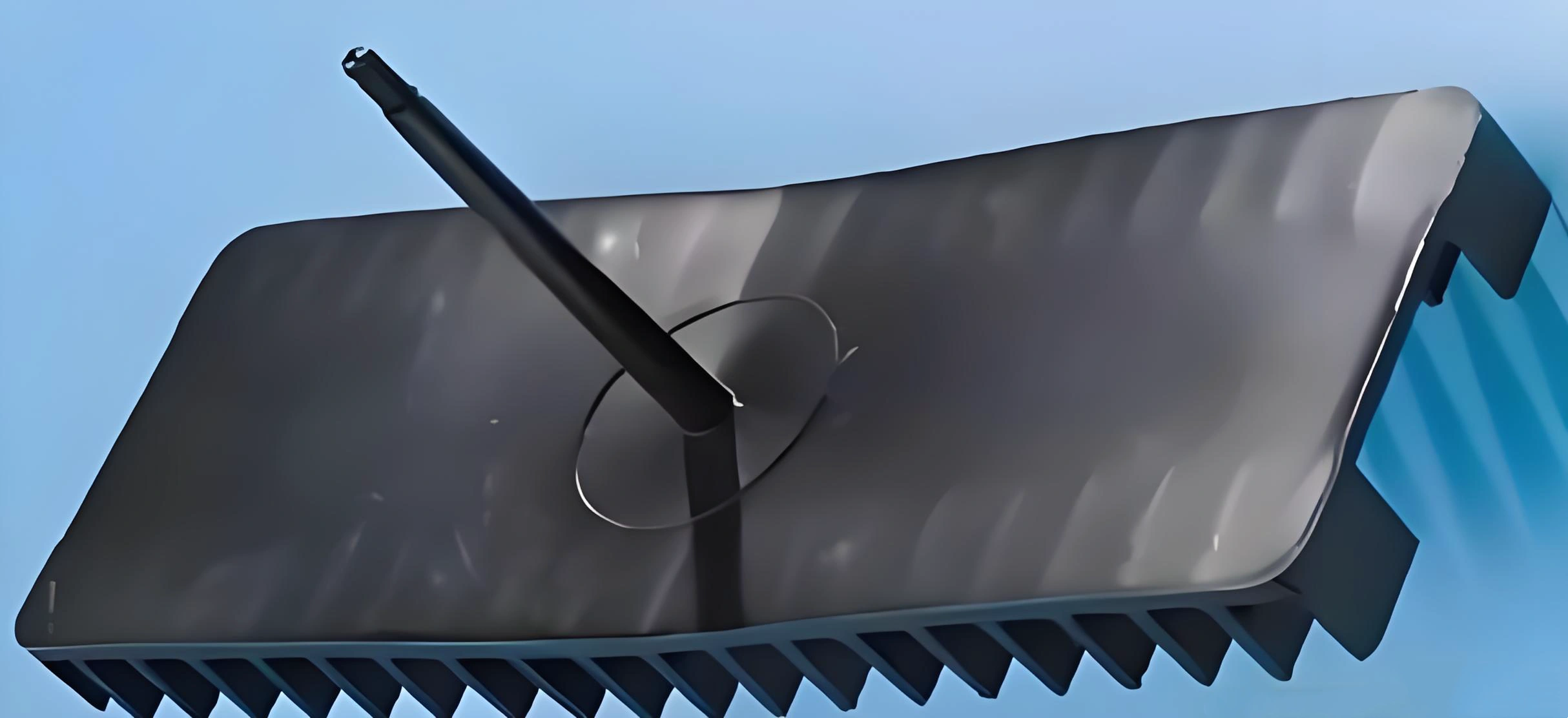 A plastic part that is noticeably warped and bent, failing to lay flat on a surface.